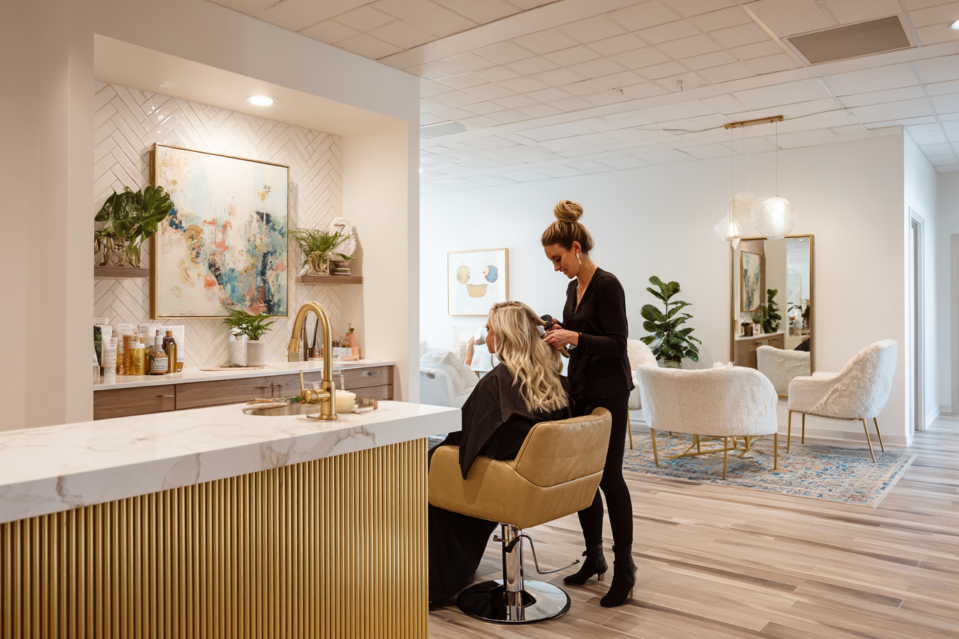 A beauty professional working in a modern salon suite